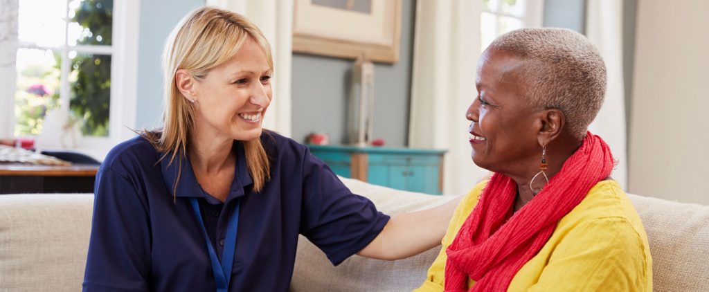 Care worker talking to lady