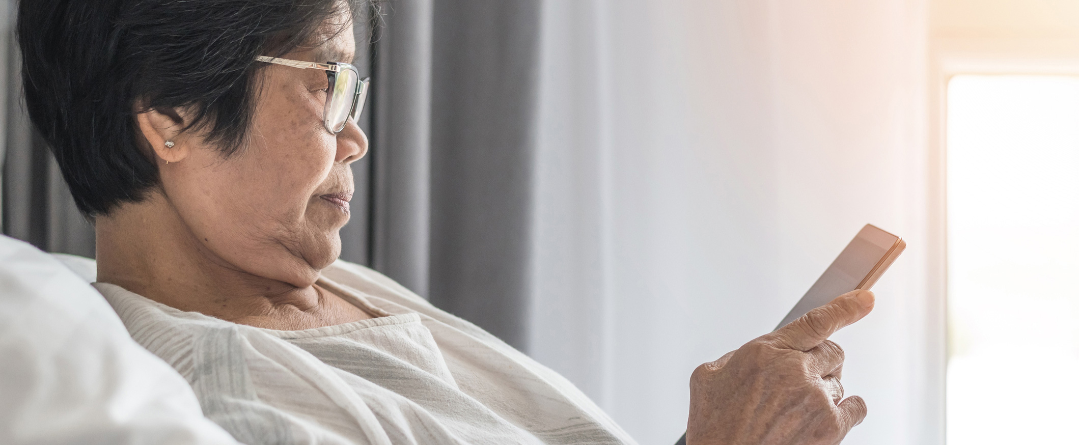 Elderly Chinese Lady on Bed